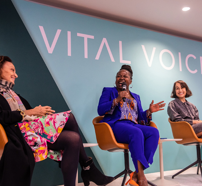 Three ladies on stage during Vital Voices event